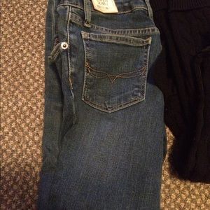 Two pair of pants and a polo sweater. Girls 8-10